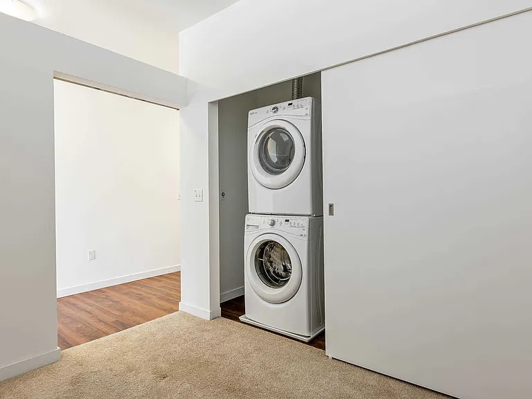 Bedroom with In-Home Washer and Dryer