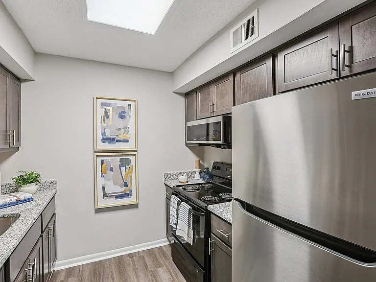 Kitchen with granite counters and modern cabinetry