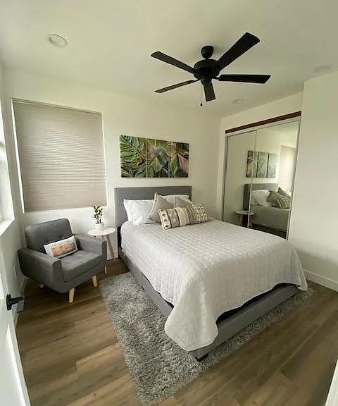 Blackout shades for a good night sleep and TV on the wall.