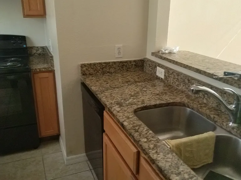 Granite countertops in kitchen area.