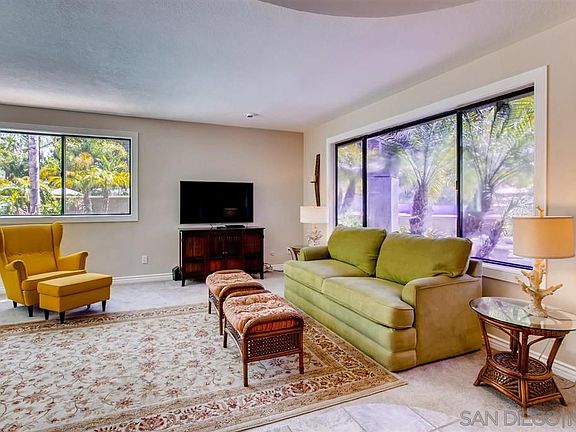 Big windows to look out at front courtyard, pool, and beautiful backyard
