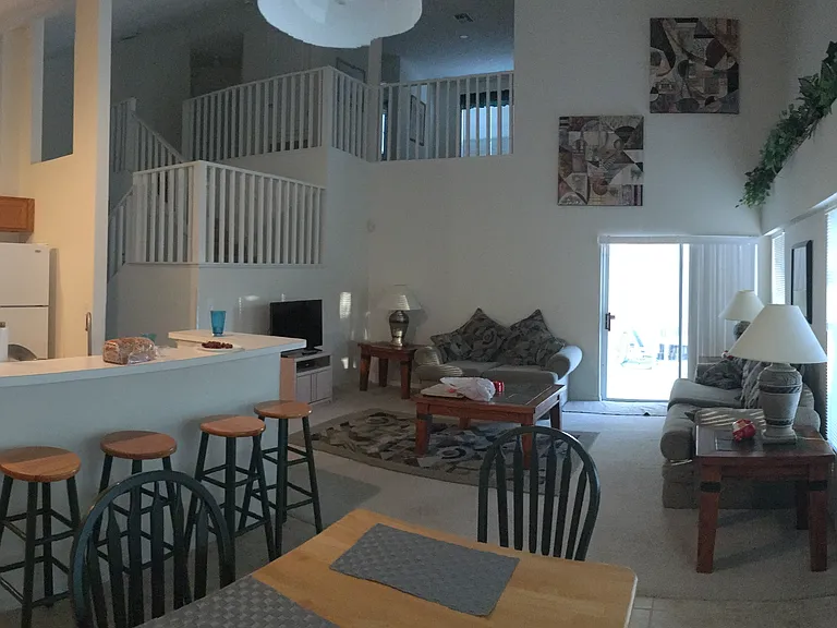 Picture of the home furnished before the luxury vinyl on the floor and new gray paint on the walls.