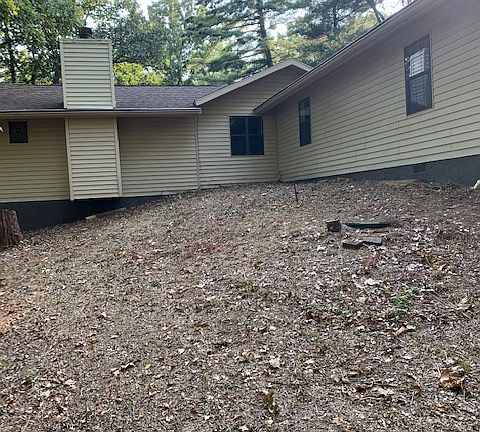 Back of home - yard has been seeded and now has grass.