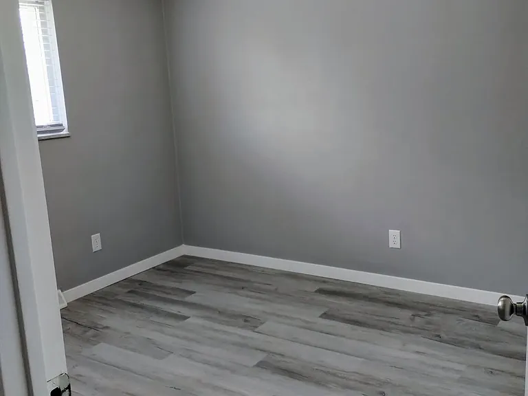BEDROOM HAS NEW WINDOW, FLOORING & NEWLY PAINTED WALLS.