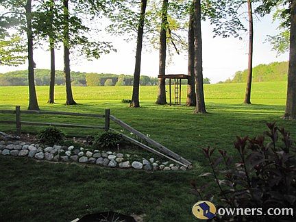 FULLY WOODED LOT WITH LANDSCAPING