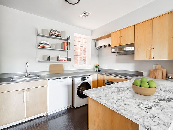 kitchen, with new dishwasher, new combo electric washer/dryer, induction range, and convection oven
