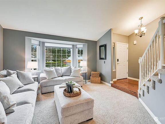 Formal Living offers Bay Window, Vaulted ceiling!  Enjoy NEW Interior paint throughout!>