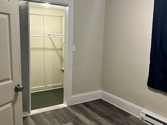 Bedroom next to kitchen with large closet