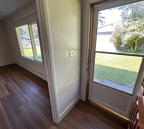 Front entry with screen door and coat closet (across from door).