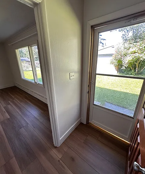 Front entry with screen door and coat closet (across from door).