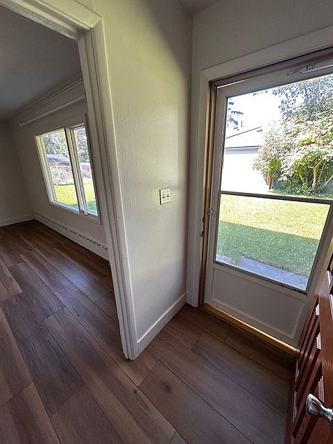 Front entry with screen door and coat closet (across from door).