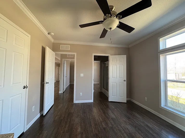 bedroom 4 with jack and jill bathroom on right and door leading out on left