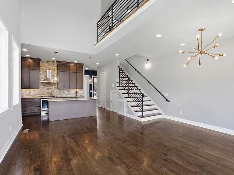 Upon entry you are met with an open floor plan and high ceilings