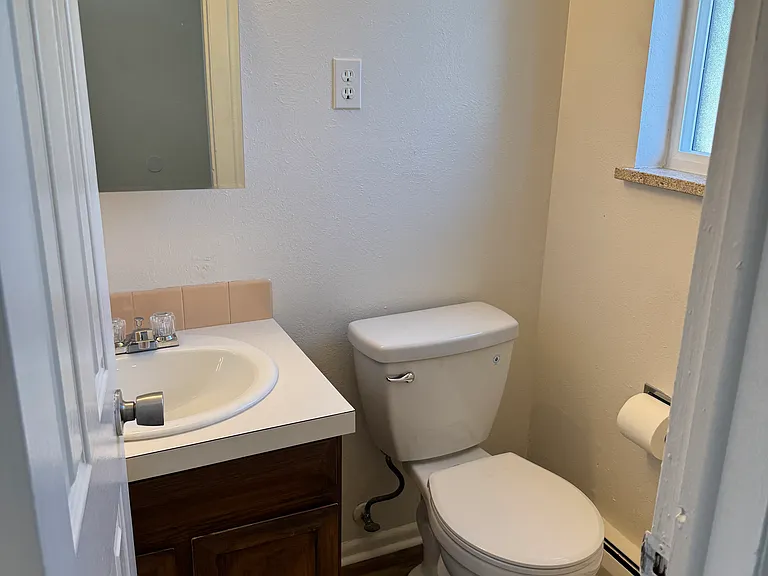 1/2 bath on mail level with new floor and toilet.