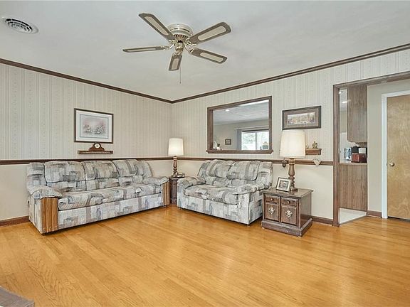 Plenty of space in living room and real hardwood floors.
