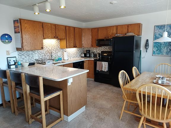 Kitchen complete with dishware.