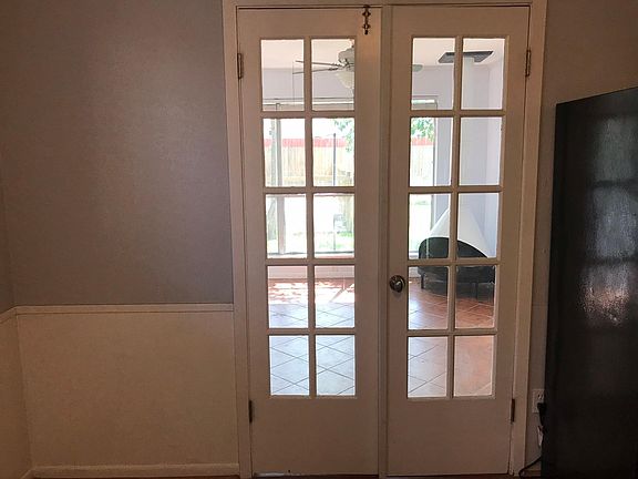 French doors from breakfast open to a sunfilled bonus room with wood burning fireplace - An outside entrance allows for the room to be set apart from the rest of the living space for an office - a great space to work or play!