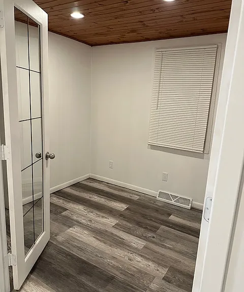 Bonus Room for office or 1/2 Bedroom. There are 2 windows with new blinds. One faces the street the other faces the side of the house. Room has a small closet. There are 2 glass french doors. This room is adjacent to Living Room.Recessed ceiling lights.