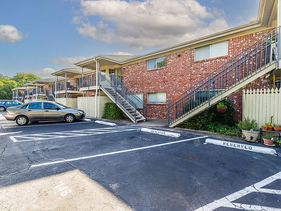 Rear patio entrance is the left rising stairway. Your two reserved parking spaces in the foreground