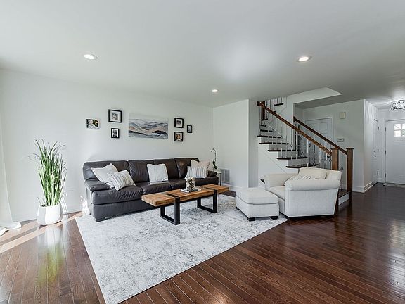 The living room is open to the dining room and kitchen.