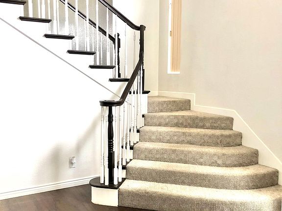 stairs lead up to the master bedroom with its own bathroom, two other rooms, and a full bathroom.