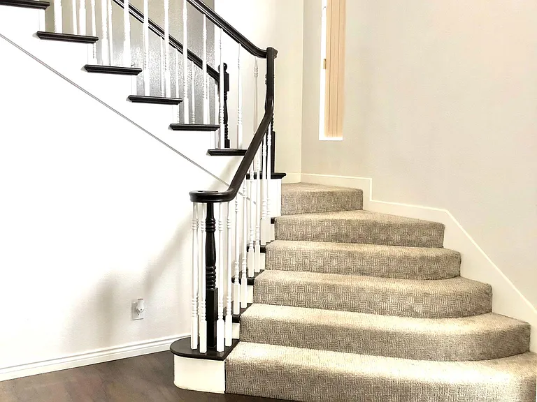 stairs lead up to the master bedroom with its own bathroom, two other rooms, and a full bathroom.