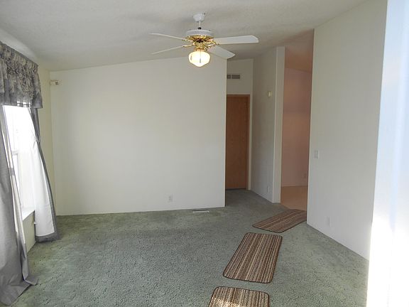 Living room looking toward master bedroom, kitchen to the ri