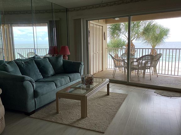 Living room overlooking balcony and Gulf