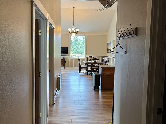 View into apartment from entry door. Bedrooms on left & bathroom on right.