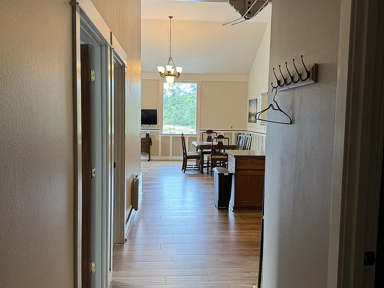 View into apartment from entry door. Bedrooms on left & bathroom on right.