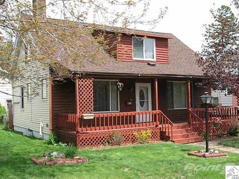 Charming 4 Bedroom 1 1/2 bath Home on a nice wide lot with a huge garage!