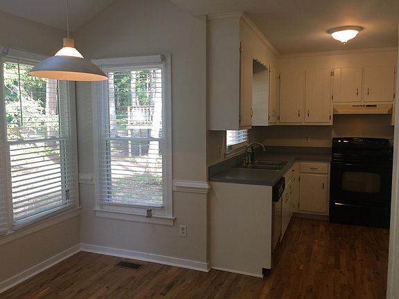 Kitchen and Partial View of Eat-In Area Featuring New 2-inch