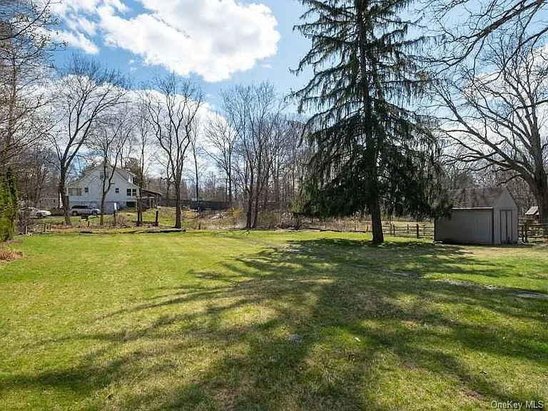 Beautiful large flat backyard area. Total .6 ac property.