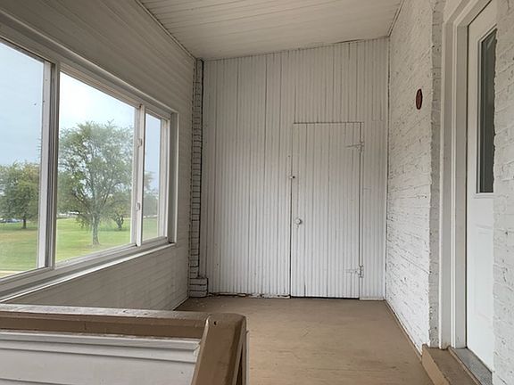 semi private enclosed porch overlooking Kenosha Yacht Club with private storage area