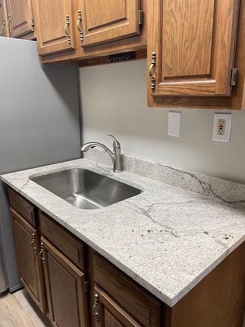 New quartz countertops along with new stainless steel sink and faucet.