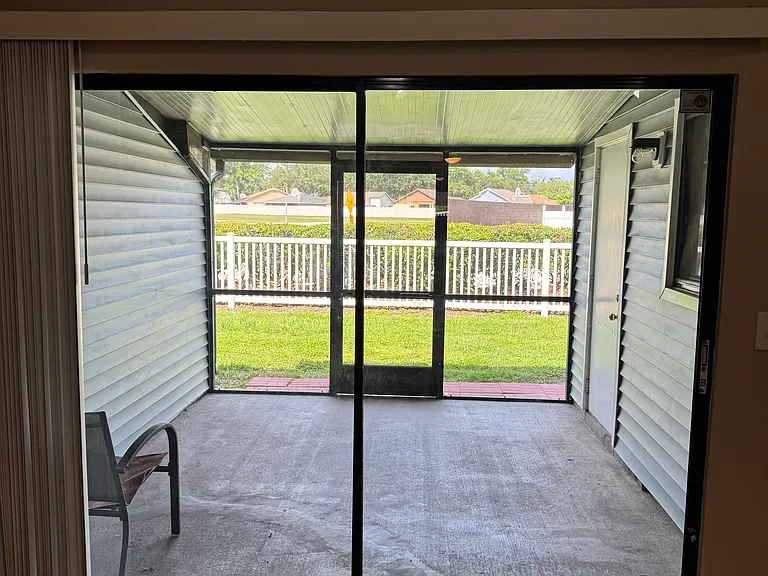 Screened lanai overlooking park