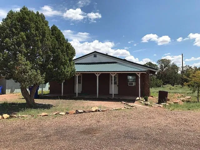 Front view of home. Has 2 front entry doors