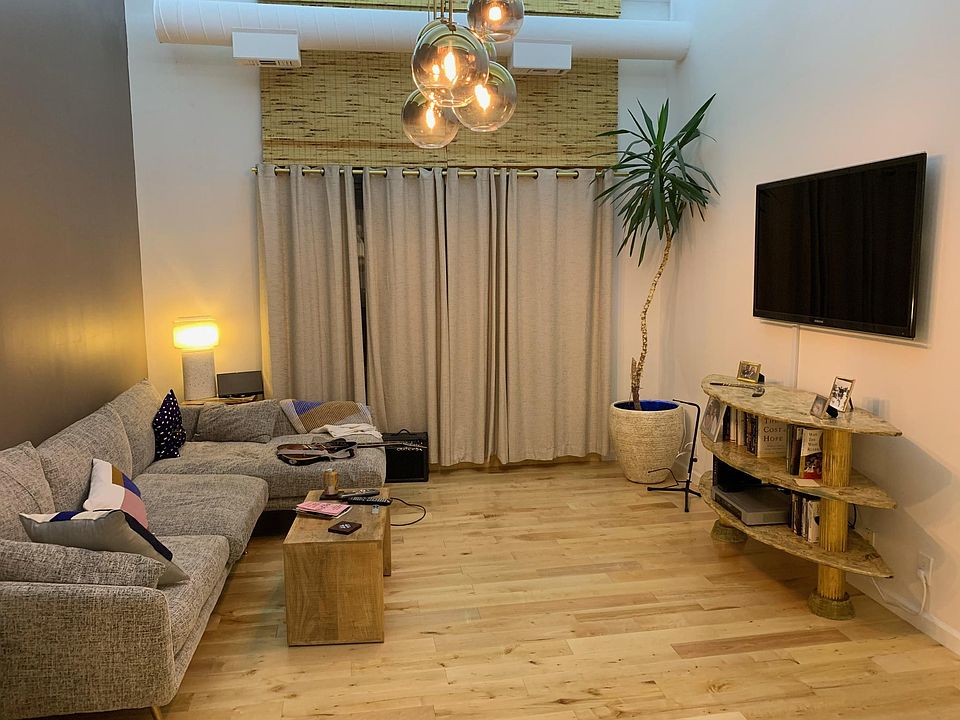 Custom lighting, tall ceilings in living room and bedroom
