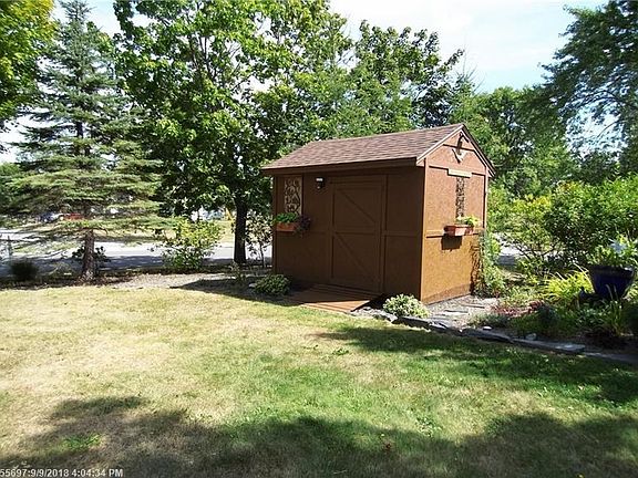 Great Yard with lots of Perenials and this shed for all your gardening tools.