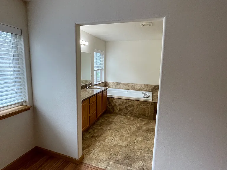 Large master bedroom, walk-in-closet with shower and jacuzzi.