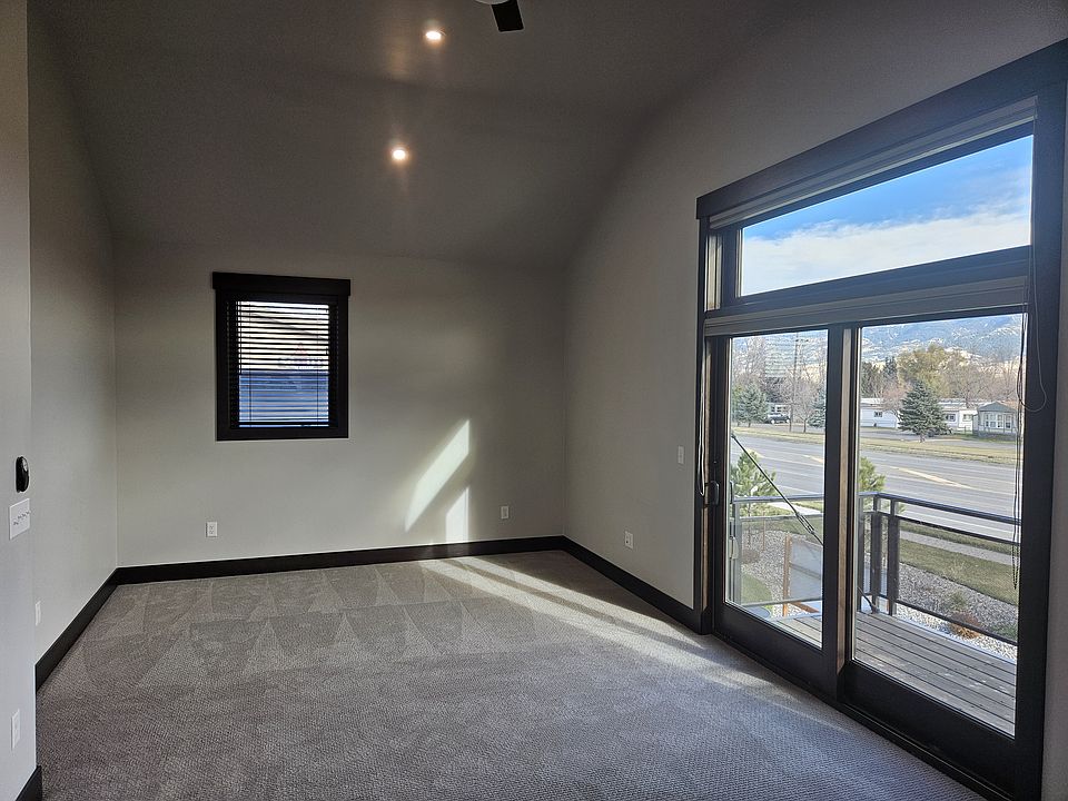 Living Area/Bedroom, 12' ceilings, windows on each side, ceiling fan, & french door w/large window above opening to patio.