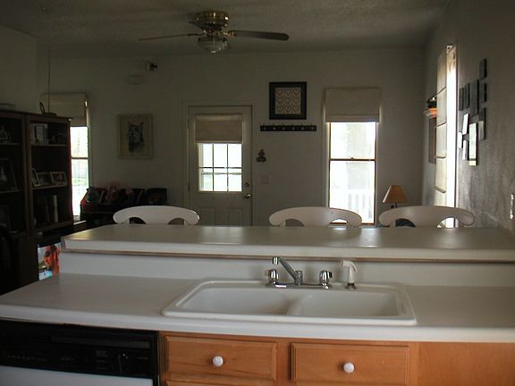 Kitchen opens to living room.