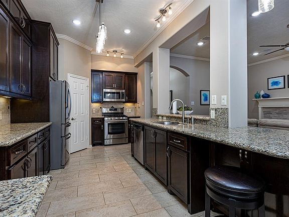 Large kitchen with custom cabinets and granite counters
