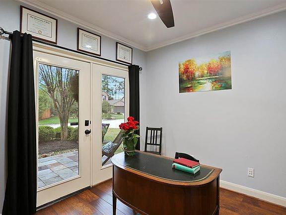 Front office space with open door to outside front patio.