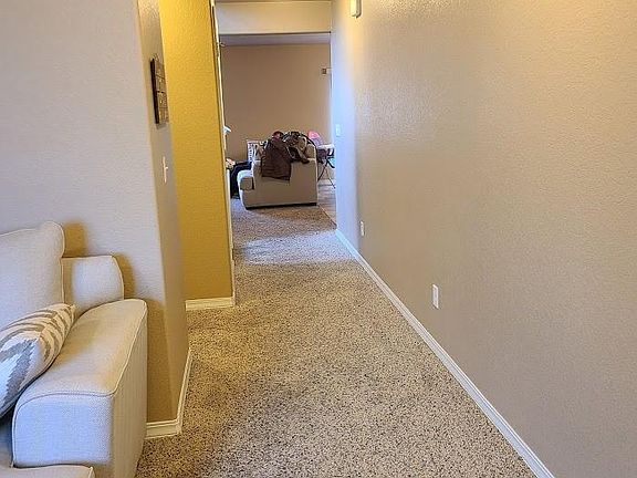 Half bath on left then opens to family room and kitchen