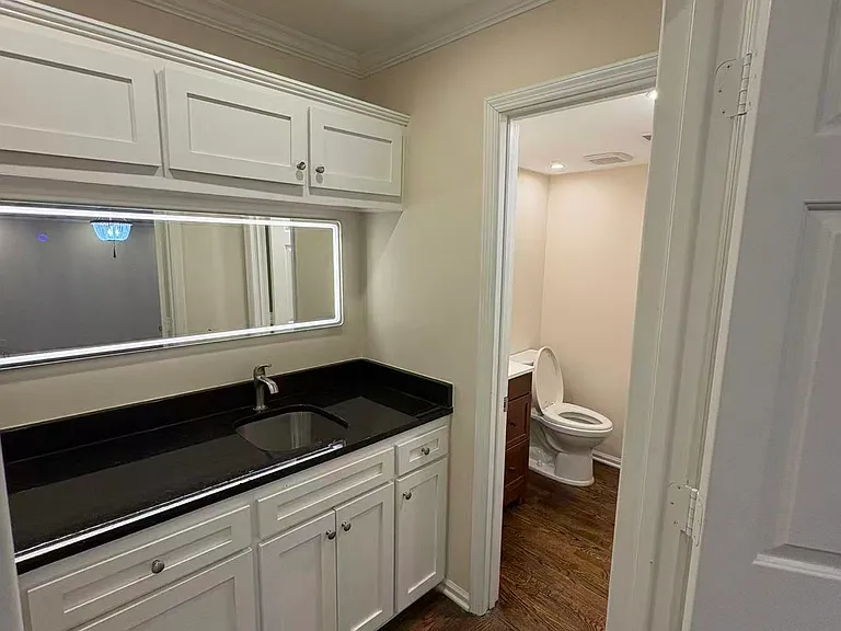 a wet bar and bathroom on the first floor