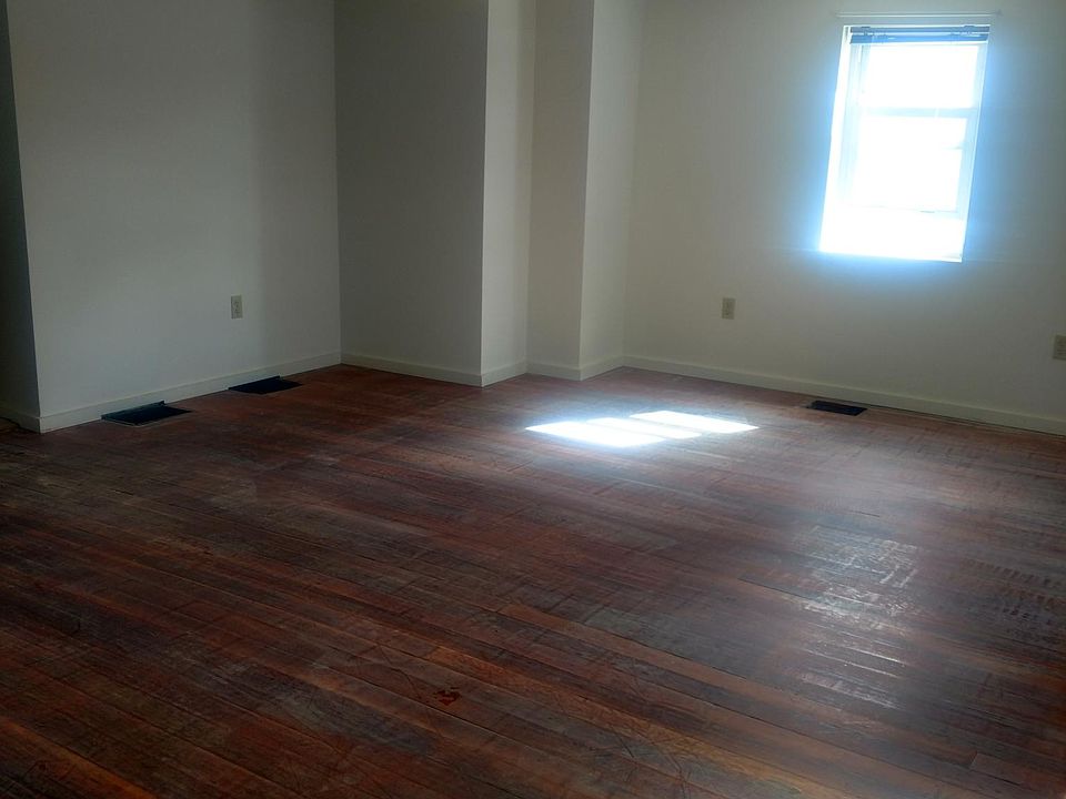 Living room, hardwood floors getting refinished.