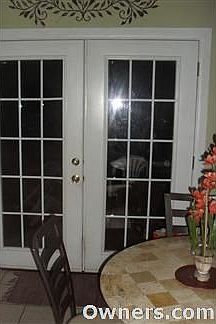 FRENCH DOORS LEADING TO BACKYARD