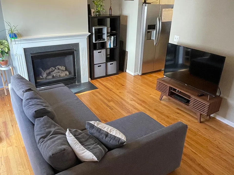 Large sunny living room with gas fireplace!