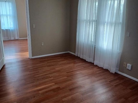 Front bedroom with view into living room